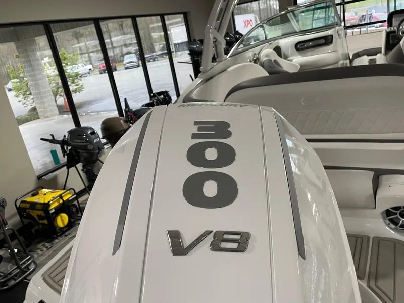 Slide: The Image of 2024 Crownline Eclipse E260 XS with 300 V8 engine in showroom. - 6