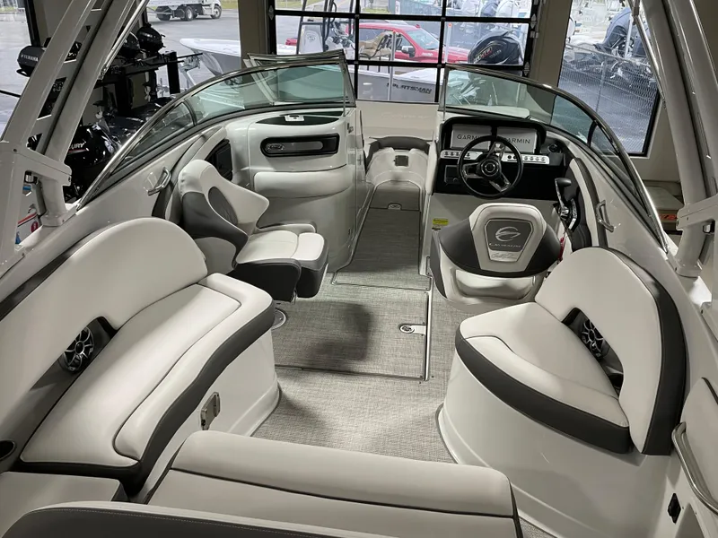 Slide: The Image of Interior of 2024 Crownline Eclipse E260 XS boat with luxurious seating and modern dashboard. - 7