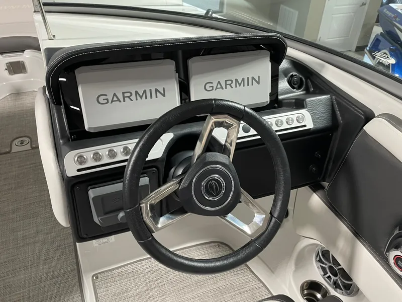 Slide: The Image of 2024 Crownline Eclipse E260 XS boat dashboard with Garmin navigation system. - 8