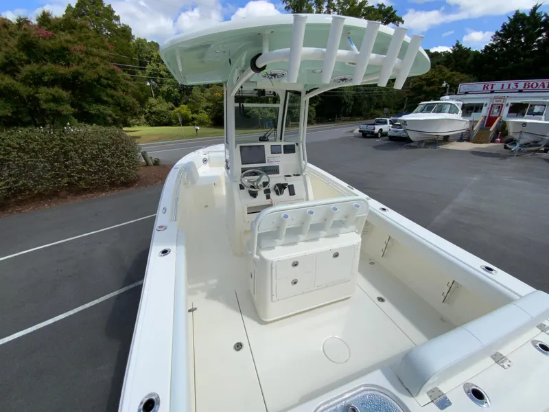 Slide: The Image of 2025 Cobia 240 Center Console boat with spacious deck and modern controls. - 10