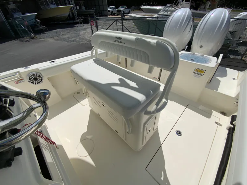 Slide: The Image of 2025 Cobia 240 Center Console boat interior with seating and steering wheel. - 12