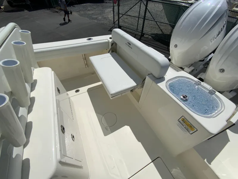 Slide: The Image of 2025 Cobia 240 Center Console boat interior with seating and storage. - 14