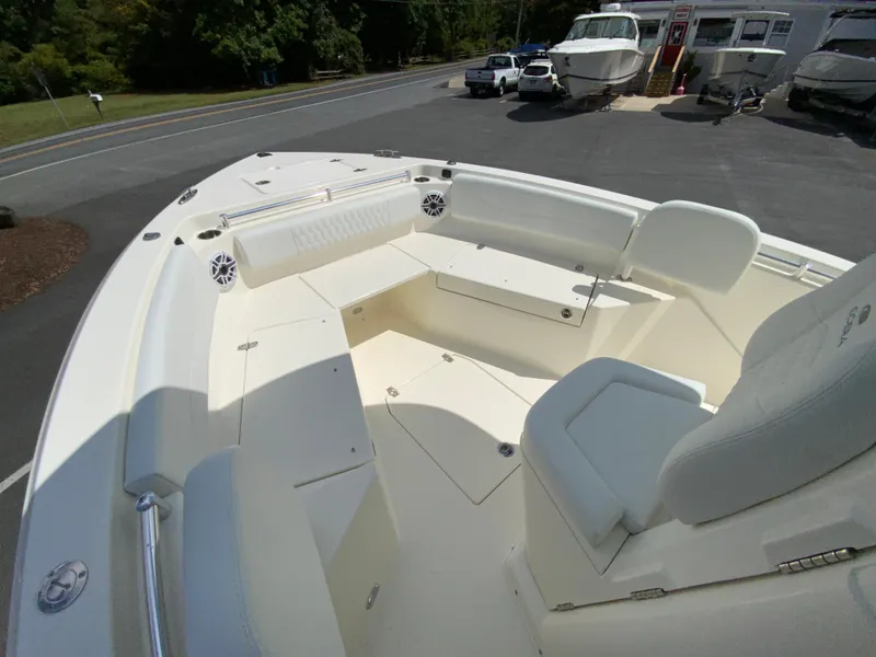 Slide: The Image of 2025 Cobia 240 Center Console boat interior with seating and storage. - 18