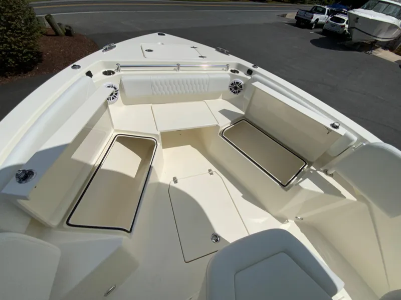 Slide: The Image of 2025 Cobia 240 Center Console boat interior with spacious seating and storage compartments. - 19