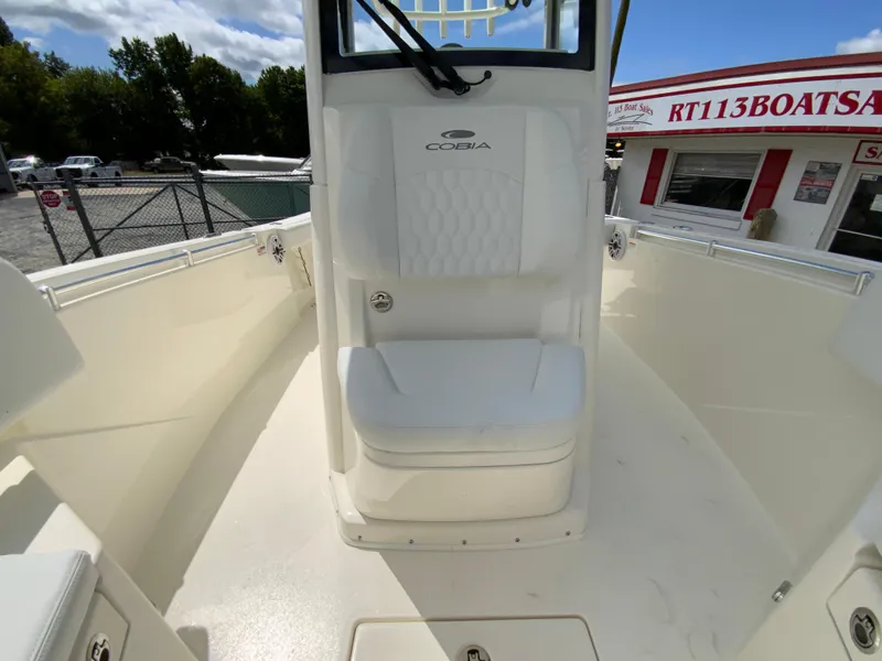 Slide: The Image of 2025 Cobia 240 Center Console boat interior with seating and console view. - 25