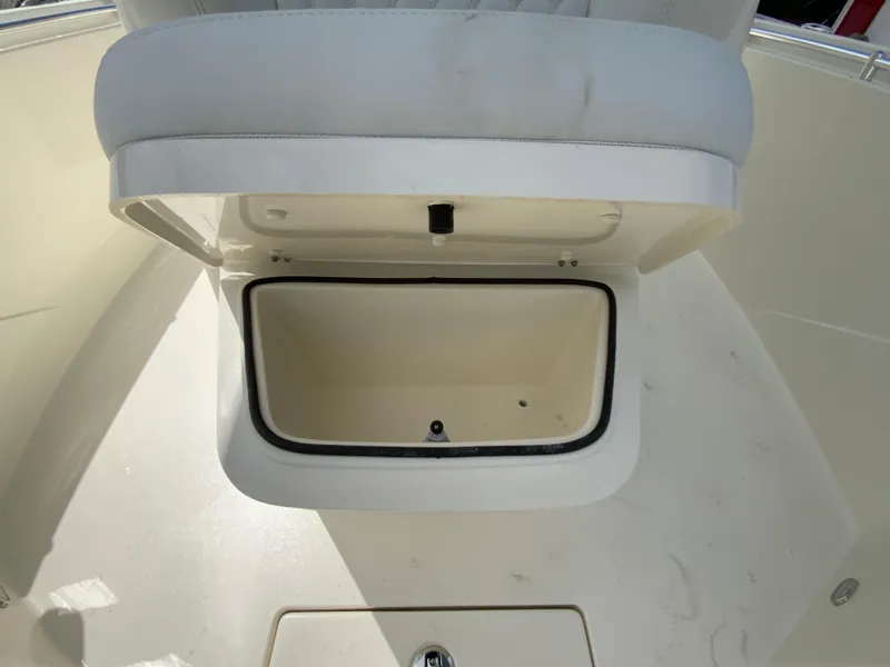 Slide: The Image of Open storage compartment on 2025 Cobia 240 Center Console boat. - 26