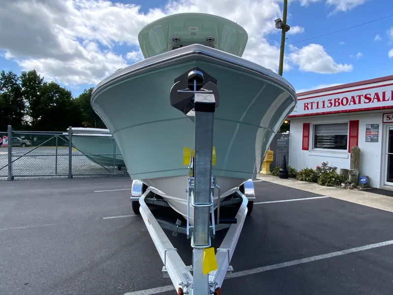 Slide: The Image of 2025 Cobia 240 Center Console boat on trailer at dealership. - 3