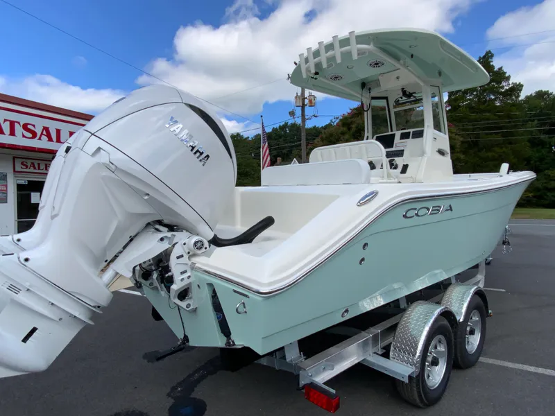Slide: The Image of 2025 Cobia 240 Center Console boat on trailer with Yamaha outboard motor. - 9