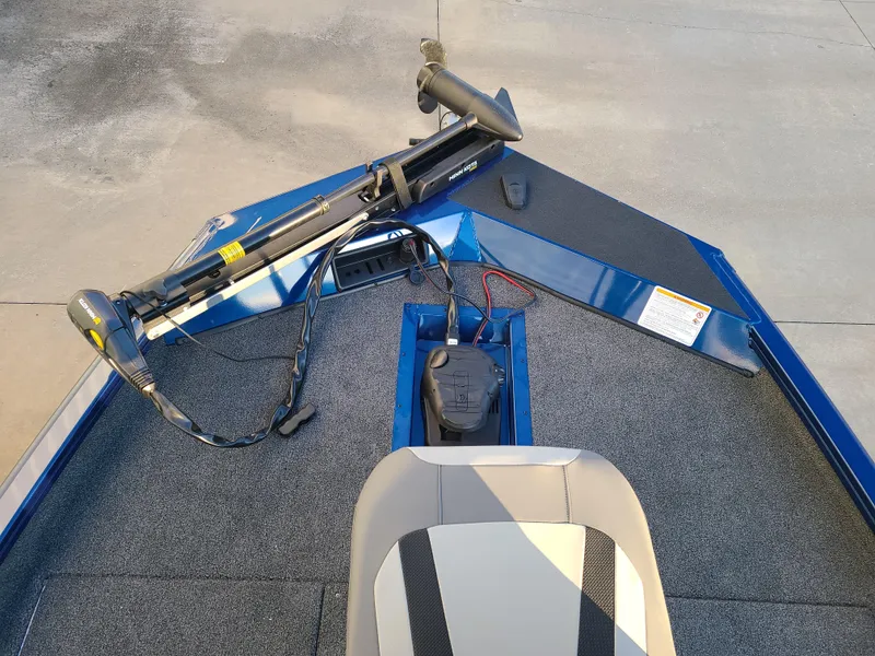 Slide: The Image of 2024 Lowe ST195B boat interior with trolling motor and seating. - 3