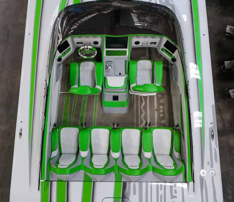 Slide: The Image of 2021 Skater 50 boat interior with green and white seating, aerial view. - 11