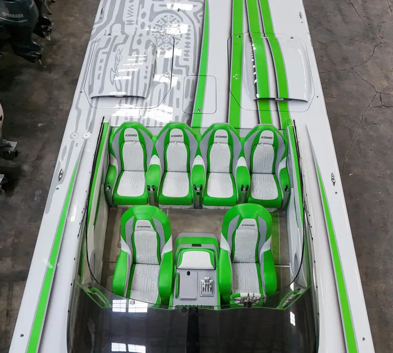Slide: The Image of Top view of 2021 Skater 50 boat with green and white seats. - 12