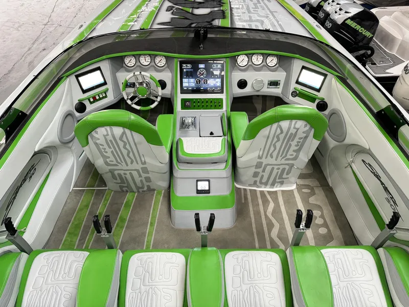 Slide: The Image of Luxurious 2021 Skater 50 boat interior with green and white seating and advanced dashboard controls. - 22