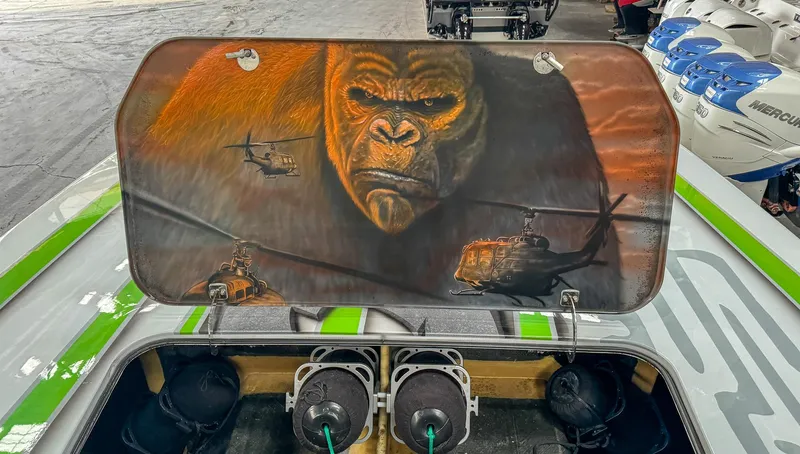 Slide: The Image of Boat engine cover art featuring a gorilla and helicopters, Skater 50 model, 2021. - 23