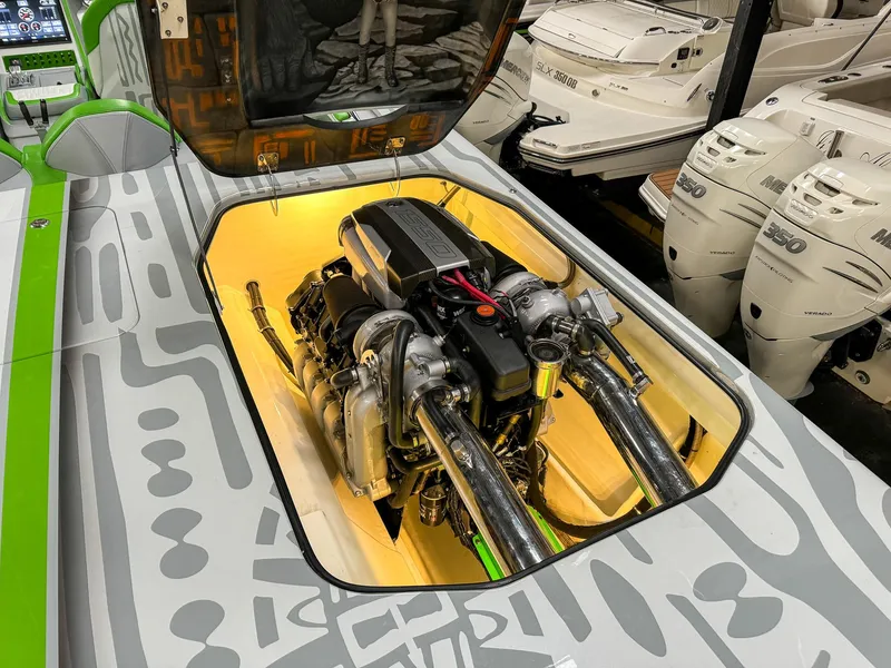 Slide: The Image of 2021 Skater 50 boat engine compartment with visible engine components. - 26