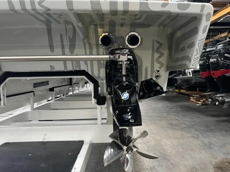 Slide: The Image of Rear view of 2021 Skater 50 boat with propeller and exhaust system in a workshop. - 42