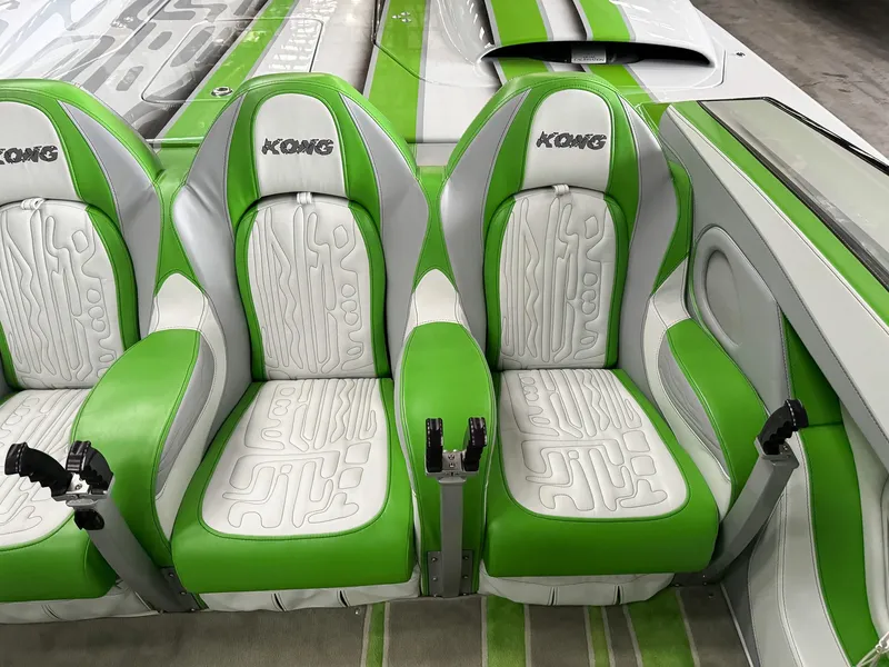 Slide: The Image of Green and white Skater 50 boat seats, 2021 model, featuring stylish design and branding. - 44