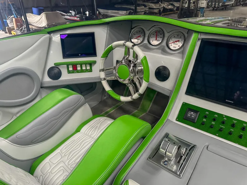 Slide: The Image of Green and white Skater 50 boat interior with modern dashboard and steering wheel, 2021 model. - 47