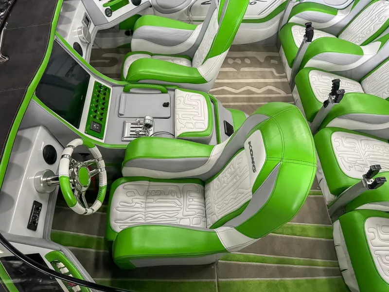 Slide: The Image of Luxurious Skater 50 boat interior, 2021 model, featuring vibrant green and white seating. - 49