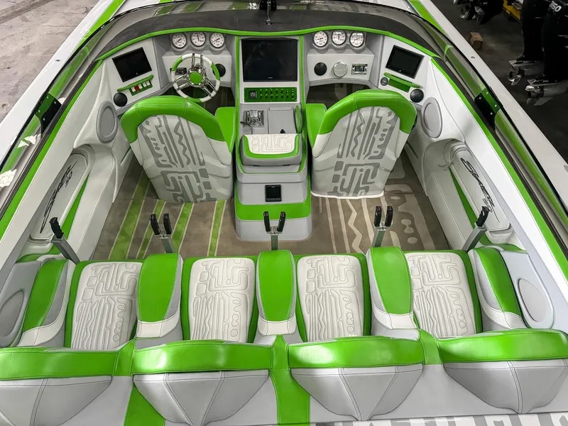 Slide: The Image of Luxurious 2021 Skater 50 boat interior with green and white seating and modern dashboard. - 5