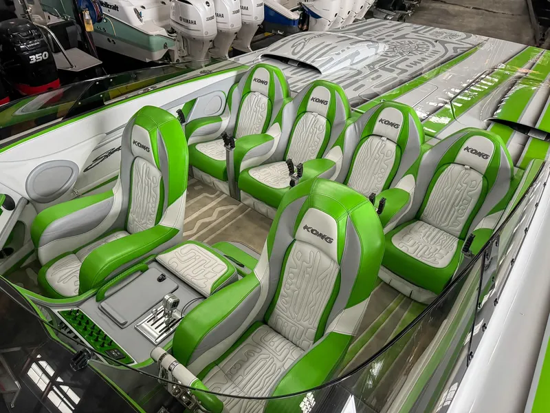 Slide: The Image of Luxurious Skater 50 boat interior, 2021 model, featuring green and white seating. - 6