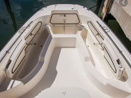 Slide: The Image of 2016 Boston Whaler 270 Dauntless boat interior with open storage compartments. - 15