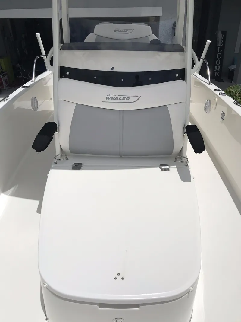 Slide: The Image of 2016 Boston Whaler 270 Dauntless boat interior with seating and console. - 18
