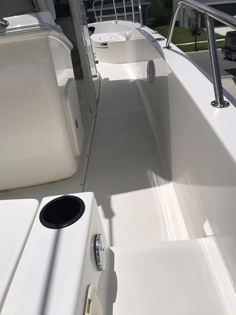 Slide: The Image of 2016 Boston Whaler 270 Dauntless boat deck with sleek white finish and stainless steel railings. - 22