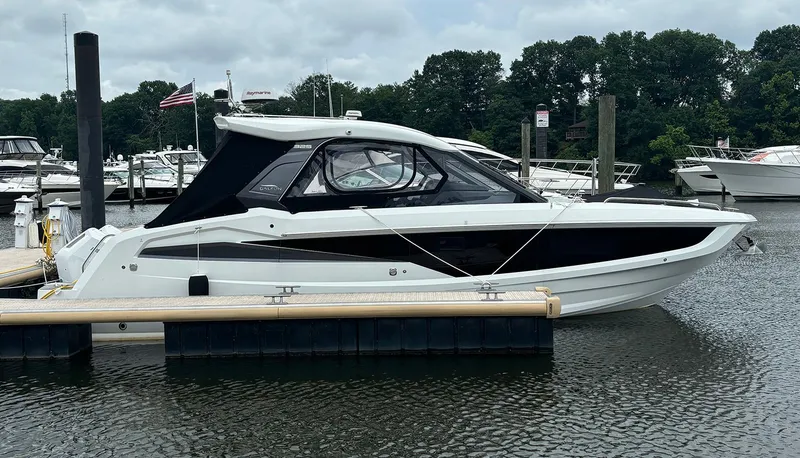 The Image of 2024 Galeon 325 GTO luxury yacht docked at a marina. - 0