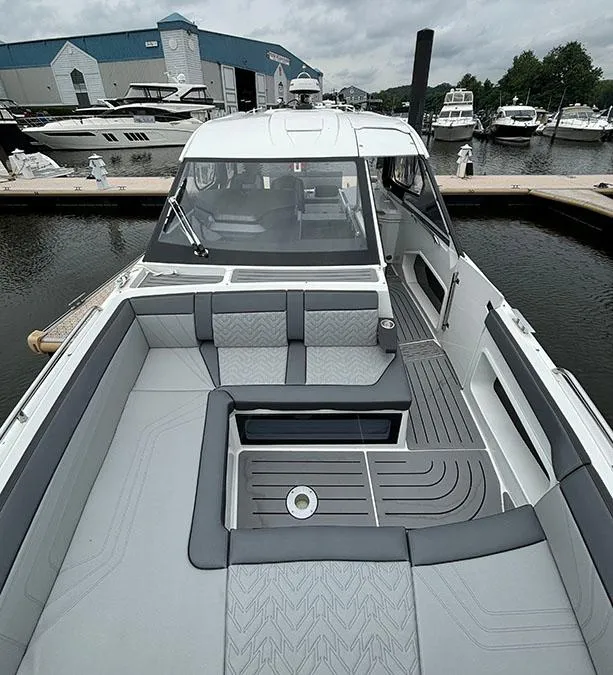 Slide: The Image of 2024 Galeon 325 GTO luxury yacht docked at a marina. - 13