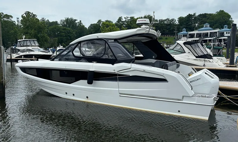Slide: The Image of 2024 Galeon 325 GTO luxury motor yacht docked in a marina. - 15