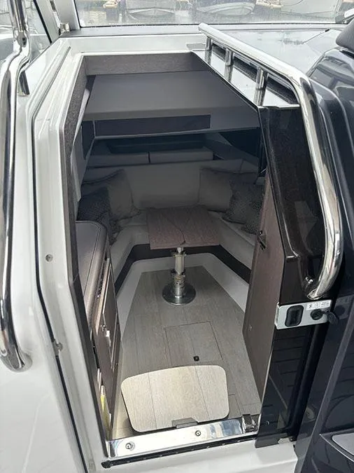 Slide: The Image of 2024 Galeon 325 GTO cabin interior with seating and table. - 17
