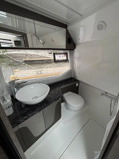Slide: The Image of Modern bathroom in 2024 Galeon 325 GTO yacht with sleek fixtures and a vessel sink. - 23