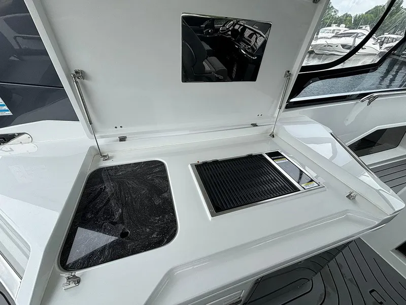 Slide: The Image of Galeon 325 GTO 2024 model boat with open outdoor kitchen and grill. - 8