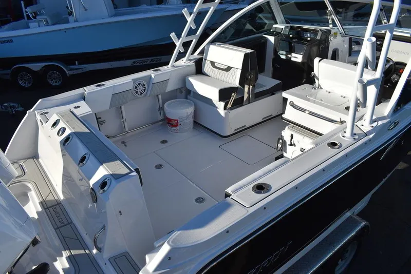 Slide: The Image of 2024 Blackfin 252DC boat interior with seating and storage compartments. - 10