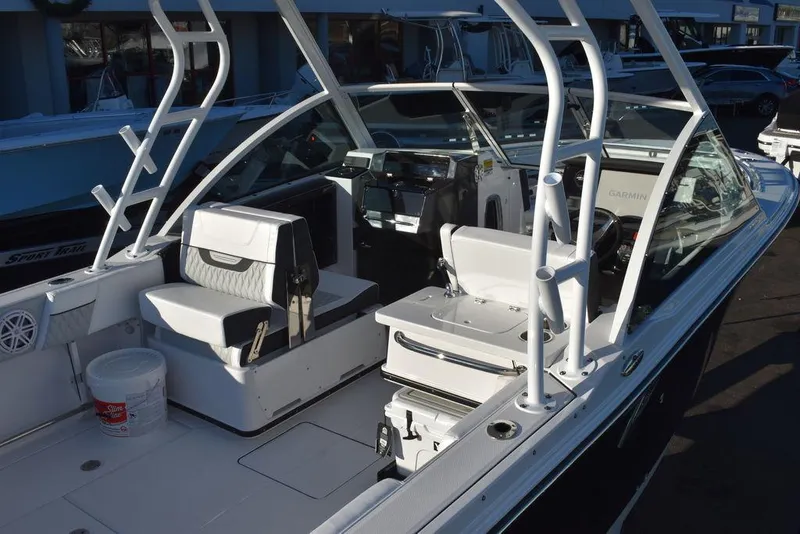 Slide: The Image of 2024 Blackfin 252DC boat interior with seating and helm, showcasing modern design. - 11