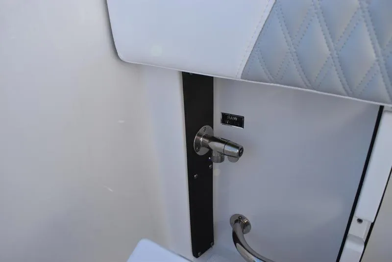 Slide: The Image of 2024 Blackfin 252DC interior detail with stainless steel hardware and quilted upholstery. - 20