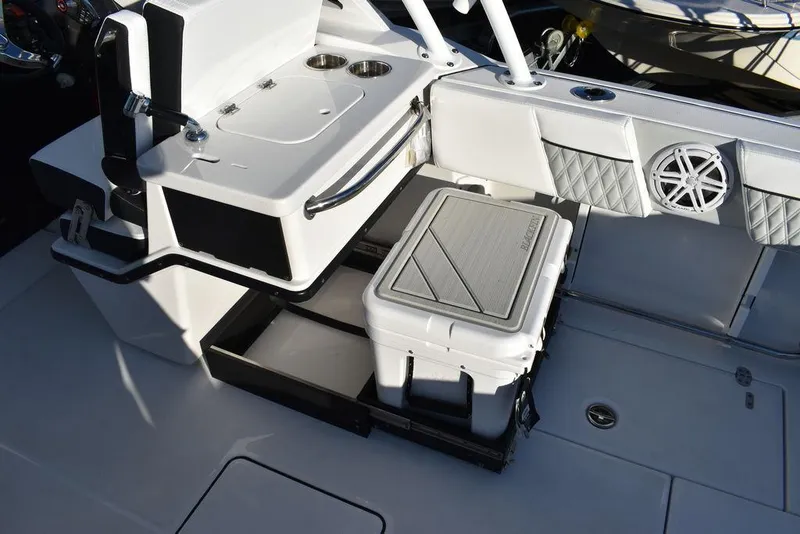 Slide: The Image of 2024 Blackfin 252DC boat interior with cooler and seating area. - 23