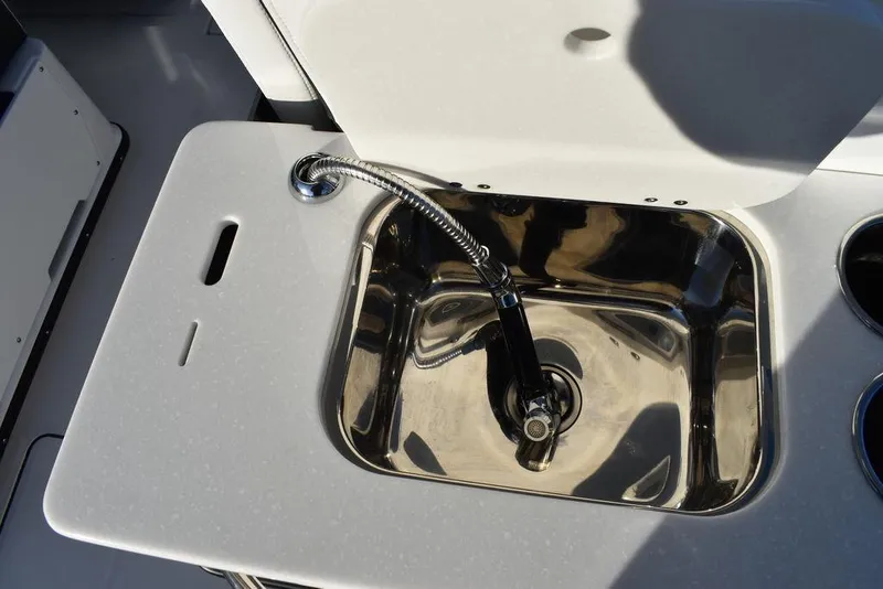 Slide: The Image of 2024 Blackfin 252DC boat sink with modern faucet design. - 25