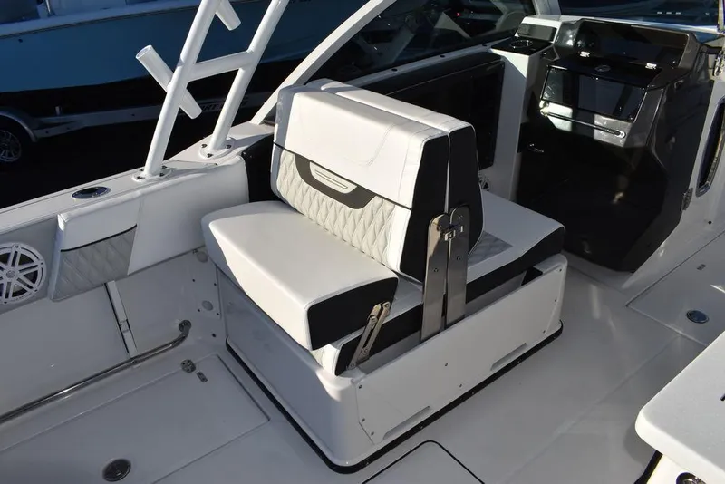 Slide: The Image of 2024 Blackfin 252DC boat interior with sleek seating and modern design. - 28