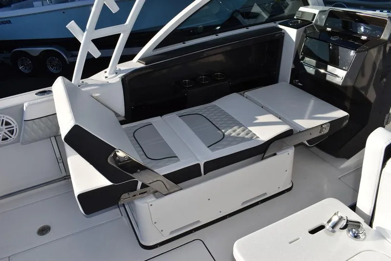 Slide: The Image of 2024 Blackfin 252DC boat interior with adjustable seating and modern design. - 30