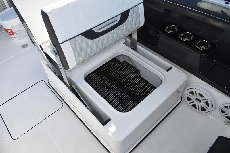 Slide: The Image of 2024 Blackfin 252DC boat seat with storage compartment and speakers. - 31