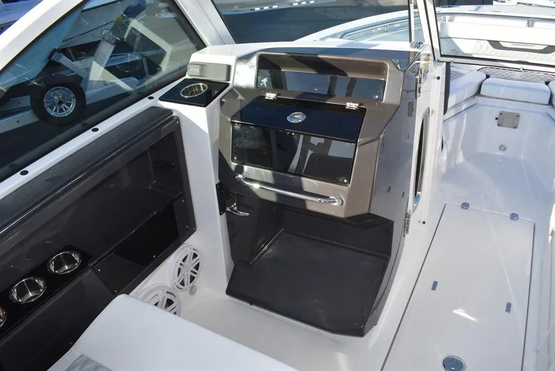 Slide: The Image of 2024 Blackfin 252DC boat interior with sleek dashboard and modern controls. - 33