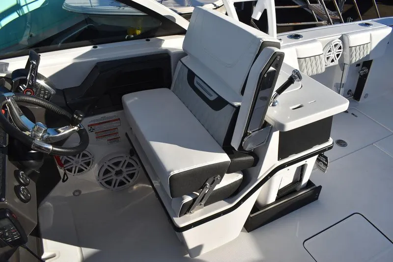 Slide: The Image of 2024 Blackfin 252DC boat interior with modern seating and steering console. - 40