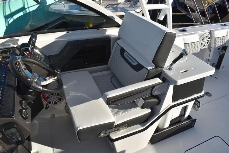 Slide: The Image of 2024 Blackfin 252DC boat interior with modern helm and seating. - 41