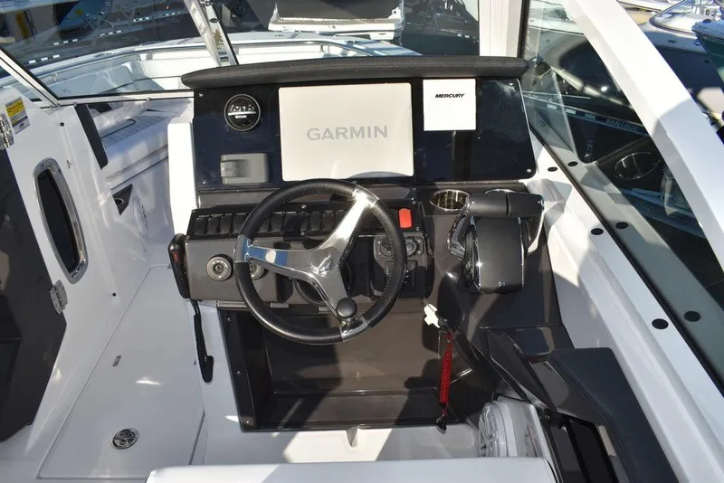 Slide: The Image of 2024 Blackfin 252DC boat dashboard with Garmin navigation system. - 42