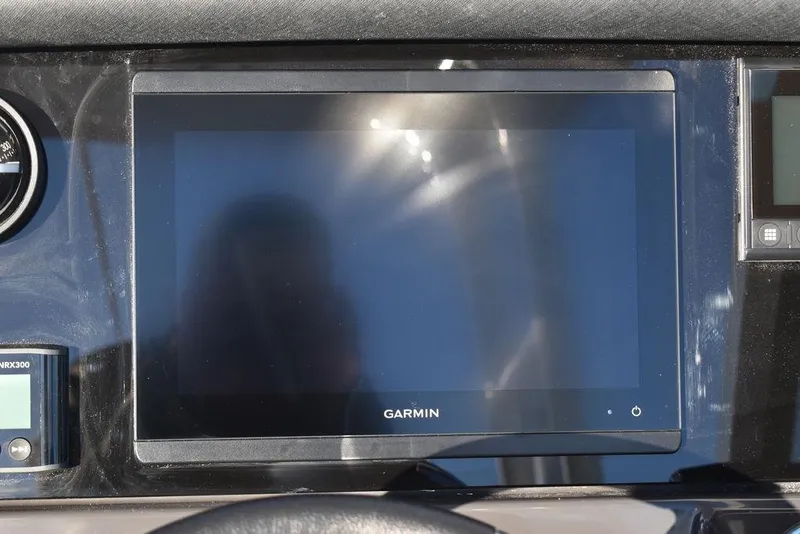 Slide: The Image of Garmin display on 2024 Blackfin 252DC boat dashboard. - 44