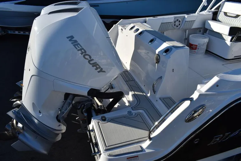 Slide: The Image of 2024 Blackfin 252DC boat with Mercury outboard engine, rear deck view. - 9