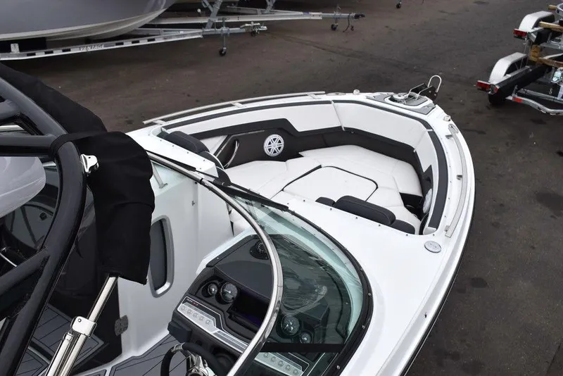 Slide: The Image of 2024 Monterey 275SS boat interior with modern dashboard and spacious seating. - 12