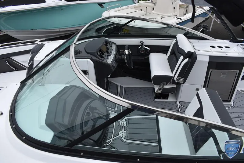 Slide: The Image of 2024 Monterey 275SS boat interior with modern dashboard and seating. - 20