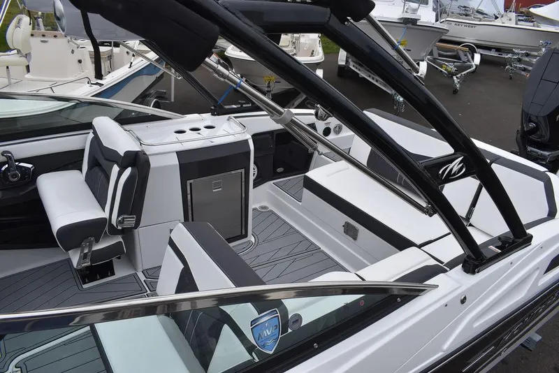 Slide: The Image of 2024 Monterey 275SS boat interior with sleek seating and modern design. - 21
